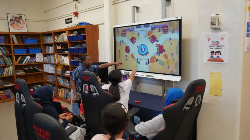 Mount Hope Esports — students at gaming stations, coaches engaging mid-match.